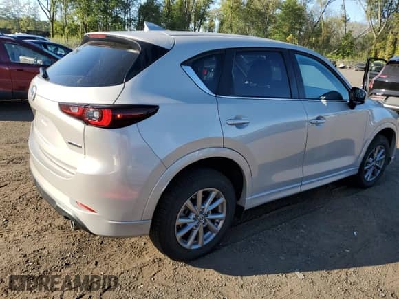 2024 Mazda CX-5 S Select z VIN JM3KFBBL6R0502168, wystawiony jako Copart lot #71203895 z przebiegiem 25 049 mil mil oraz Szkoda całkowita • Salvage title. Historia ofert i sprzedaży dostępna na DreamBid. Obrazek 3.
