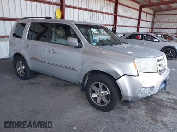 2009 Honda Pilot Touring with VIN 5FNYF48929B004092, listed as a IAAI auction lot 43116551 with 232,447 mi miles and . Bid and sale history available at DreamBid. Image 1.