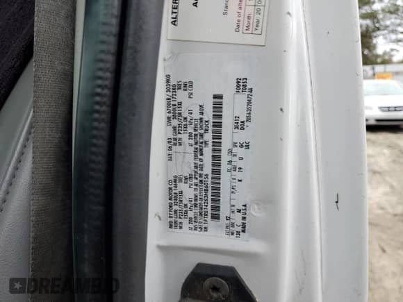 2003 Ford Econoline Cargo z VIN 1FTRE14263HB60156, wystawiony jako Copart lot #85138954 z przebiegiem 202 624 mil mil oraz Czysty tytuł • Clean title. Historia ofert i sprzedaży dostępna na DreamBid. Obrazek 12.