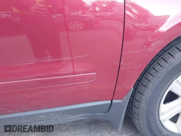 2013 Chevrolet Traverse LT z VIN 1GNKVJKD4DJ136963, wystawiony jako IAAI lot #43385919 z przebiegiem 124 879 mil mil oraz . Historia ofert i sprzedaży dostępna na DreamBid. Obrazek 6.