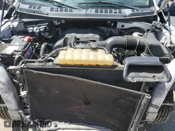 2018 Ford F-150 XL z VIN 1FTMF1CP2JKE25806, wystawiony jako Copart lot #69967395 z przebiegiem 141 718 mil mil oraz Szkoda całkowita • Salvage title. Historia ofert i sprzedaży dostępna na DreamBid. Obrazek 11.