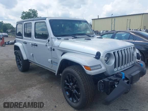 2023 Jeep Wrangler Sahara with VIN 1C4JJXP69PW695915, listed as a IAAI auction lot 42662028 with 36,957 mi miles and . Bid and sale history available at DreamBid. Image 1.