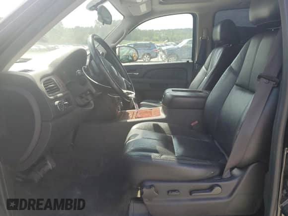 2012 Chevrolet Suburban LT with VIN 1GNSCJE00CR101481, listed as a Copart auction lot 69094655 with 174,206 mi miles and Salvage title. Bid and sale history available at DreamBid. Image 7.