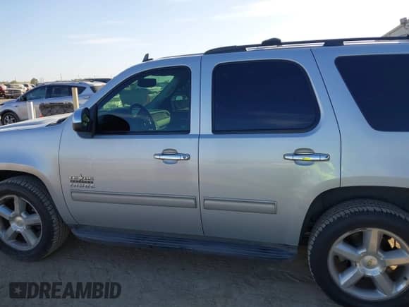 2014 Chevrolet Tahoe LS with VIN 1GNSCAE06ER144631, listed as a IAAI auction lot 42872921 with 196,796 mi miles and . Bid and sale history available at DreamBid. Image 15.