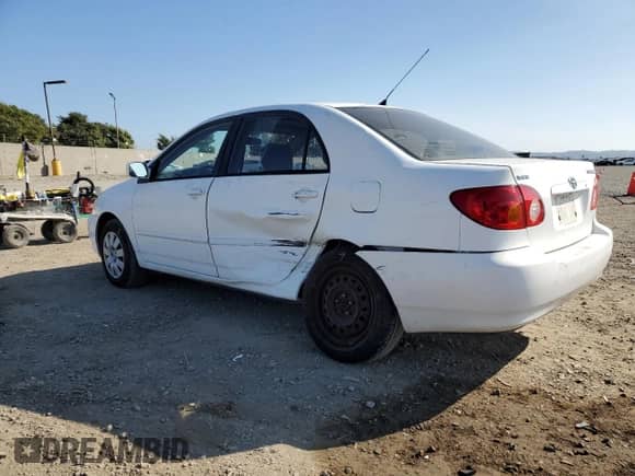 2003 Toyota Corolla LE with VIN JTDBR32E730050858, listed as a Copart auction lot 84818375 with 163,106 mi miles and Salvage title. Bid and sale history available at DreamBid. Image 2.
