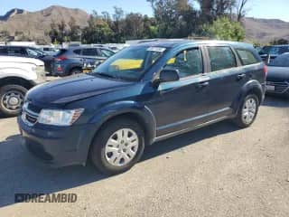 2015 Dodge Journey American Value with VIN 3C4PDCAB7FT517909, listed as a Copart auction lot 86871995 with 94,014 mi miles and Clean title. Bid and sale history available at DreamBid. Image 1.