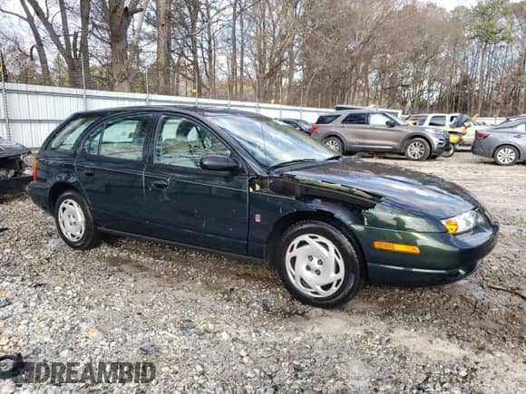 2000 Saturn SW with VIN 1G8ZN8271YZ126385, listed as a Copart auction lot 45371485 with 170,379 mi miles and Salvage title. Bid and sale history available at DreamBid. Image 4.