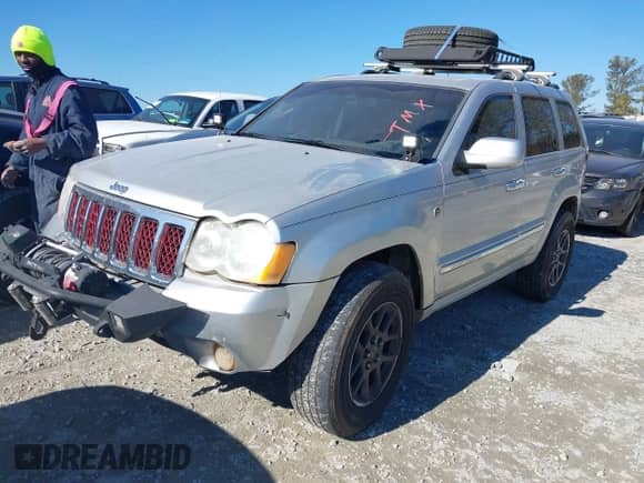 2009 Jeep Grand Cherokee with VIN 1J8HR68T39C540795, listed as a IAAI auction lot 41379112 with 236,624 mi miles and . Bid and sale history available at DreamBid. Image 20.