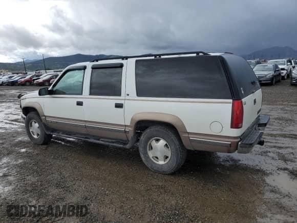 1996 Chevrolet Suburban с VIN 1GNFK16R5TJ316550, выставлен на аукционе Copart как лот 56913175 с пробегом 202 840 миль миль и Чистый • Clean title. История ставок и продаж доступна на DreamBid. Изображение 2.