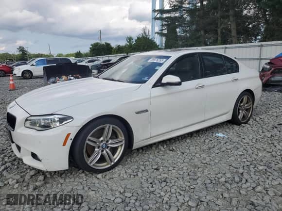 2016 BMW 5 Series 550i xDrive with VIN WBAKP9C55GD981149, listed as a Copart auction lot 65976265 with 121,838 mi miles and Salvage title. Bid and sale history available at DreamBid. Image 1.