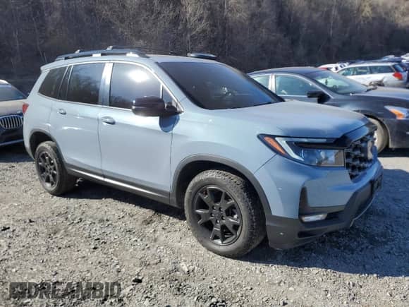 2022 Honda Passport TrailSport with VIN 5FNYF8H62NB004097, listed as a Copart auction lot 52331095 with 27,318 mi miles and Salvage title. Bid and sale history available at DreamBid. Image 4.