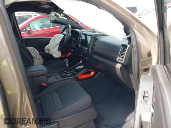 2023 Nissan Frontier Pro-X with VIN 1N6ED1EJXPN657609, listed as a IAAI auction lot 42852823 with 22,584 mi miles and . Bid and sale history available at DreamBid. Image 5.