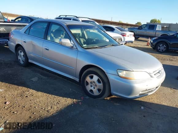 2002 Honda Accord EX with VIN 1HGCG16542A073212, listed as a IAAI auction lot 43560674 with 154,935 mi miles and . Bid and sale history available at DreamBid. Image 1.