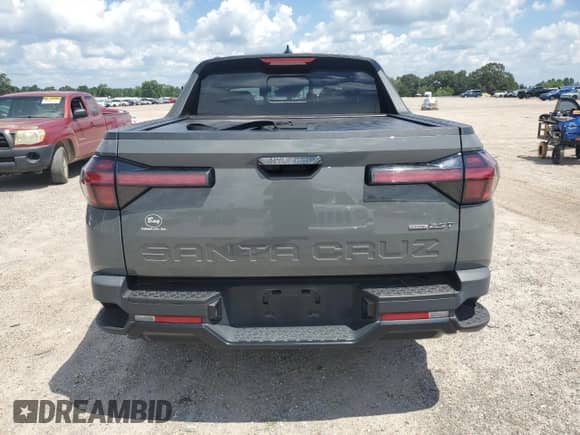 2023 Hyundai Santa Cruz Night Edition с VIN 5NTJCDAF6PH063978, выставлен на аукционе Copart как лот 66947895 с пробегом 39 086 миль миль и Списание • Salvage title. История ставок и продаж доступна на DreamBid. Изображение 6.