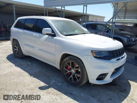 2017 Jeep Grand Cherokee SRT z VIN 1C4RJFDJ0HC699537, wystawiony jako IAAI lot #41781500 z przebiegiem 105 640 mil mil oraz . Historia ofert i sprzedaży dostępna na DreamBid. Obrazek 1.