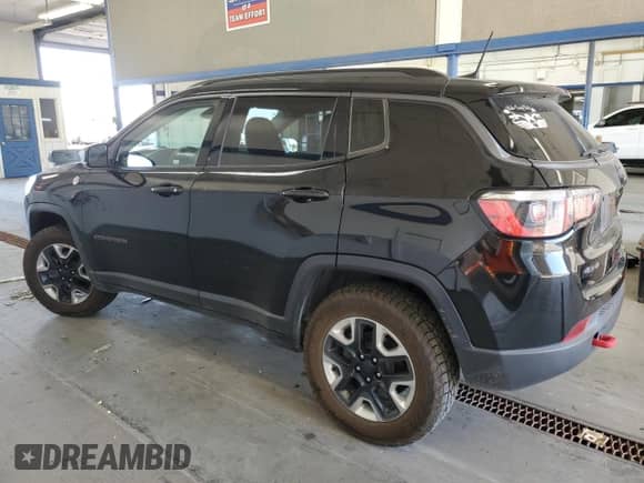 2017 Jeep Compass Trailhawk with VIN 3C4NJDDBXHT647011, listed as a Copart auction lot 65583185 with 106,438 mi miles and Salvage title. Bid and sale history available at DreamBid. Image 2.