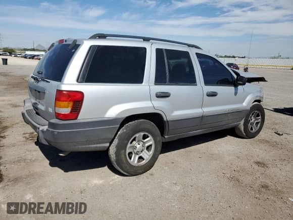 2003 Jeep Grand Cherokee Laredo z VIN 1J4GX48S53C581242, wystawiony jako Copart lot #70820065 z przebiegiem 212 955 mil mil oraz Szkoda całkowita • Salvage title. Historia ofert i sprzedaży dostępna na DreamBid. Obrazek 3.