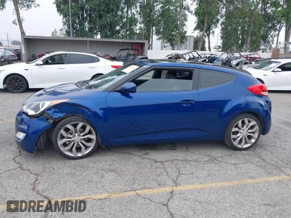 2015 Hyundai Veloster z VIN KMHTC6AD0FU243328, wystawiony jako IAAI lot #42439313 z przebiegiem 96 997 mil mil oraz . Historia ofert i sprzedaży dostępna na DreamBid. Obrazek 14.