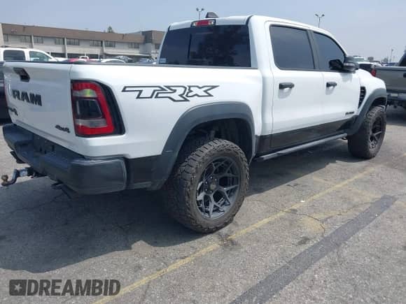 2022 Ram 1500 TRX z VIN 1C6SRFU97NN168472, wystawiony jako IAAI lot #42160696 z przebiegiem 13 695 mil mil oraz . Historia ofert i sprzedaży dostępna na DreamBid. Obrazek 4.