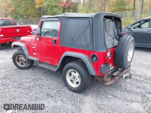 2002 Jeep Wrangler Sport z VIN 1J4FA49S92P715110, wystawiony jako IAAI lot #43455131 z przebiegiem 153 258 mil mil oraz . Historia ofert i sprzedaży dostępna na DreamBid. Obrazek 3.