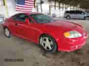 2003 Hyundai Tiburon GT z VIN KMHHN65F53U086483, wystawiony jako Copart lot #53391495 z przebiegiem 153 544 mil mil oraz Szkoda całkowita • Salvage title. Historia ofert i sprzedaży dostępna na DreamBid. Obrazek 4.