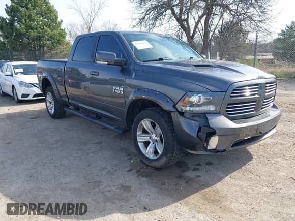 2014 Ram 1500 Sport with VIN 1C6RR7UT0ES155788, listed as a IAAI auction lot 42104074 with 162,777 mi miles and . Bid and sale history available at DreamBid. Image 1.