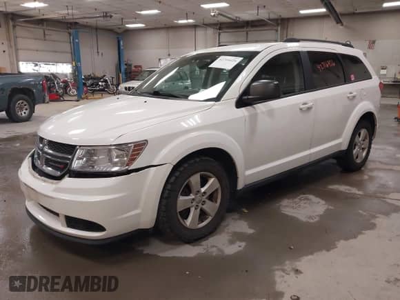 2014 Dodge Journey SE with VIN 3C4PDDAG5ET174551, listed as a IAAI auction lot 42716426 with 156,765 mi miles and . Bid and sale history available at DreamBid. Image 2.