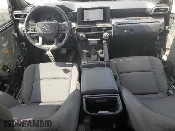 2024 Toyota Tacoma SR5 with VIN 3TMKB5FN1RM023512, listed as a Copart auction lot 68438505 with 5,994 mi miles and Salvage title. Bid and sale history available at DreamBid. Image 8.