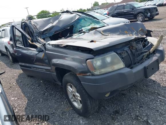2004 Jeep Grand Cherokee Laredo z VIN 1J4GW48S04C338331, wystawiony jako IAAI lot #42392612 z przebiegiem Nie podano mil oraz . Historia ofert i sprzedaży dostępna na DreamBid. Obrazek 1.