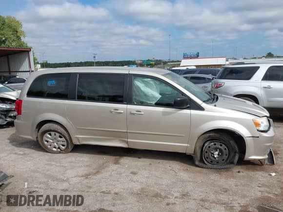 2014 Dodge Grand Caravan SE with VIN 2C4RDGBG8ER309405, listed as a IAAI auction lot 43276389 with 242,036 mi miles and . Bid and sale history available at DreamBid. Image 13.