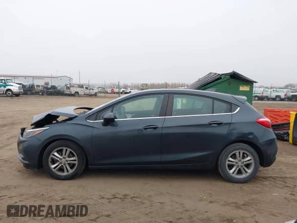 2017 Chevrolet Cruze LT z VIN 3G1BE6SM3HS548584, wystawiony jako IAAI lot #41208267 z przebiegiem 105 807 mil mil oraz . Historia ofert i sprzedaży dostępna na DreamBid. Obrazek 14.