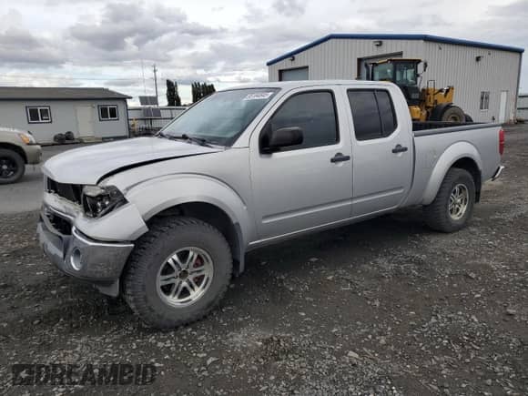 2007 Nissan Frontier LE with VIN 1N6AD09W67C461323, listed as a Copart auction lot 85184845 with 212,175 mi miles and Salvage title. Bid and sale history available at DreamBid. Image 1.