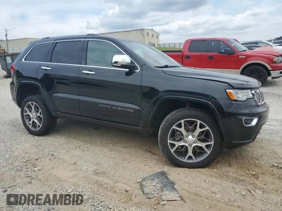 2020 Jeep Grand Cherokee Overland with VIN 1C4RJFCGXLC344406, listed as a Copart auction lot 81594155 with 98,750 mi miles and Salvage title. Bid and sale history available at DreamBid. Image 4.