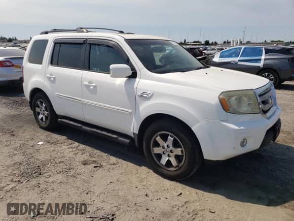 2010 Honda Pilot Touring with VIN 5FNYF4H86AB001871, listed as a Copart auction lot 70506155 with 133,582 mi miles and Salvage title. Bid and sale history available at DreamBid. Image 4.