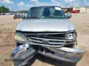 2002 Ford F-150 XLT with VIN 1FTRW07602KB73444, listed as a IAAI auction lot 42744286 with 208,152 mi miles and . Bid and sale history available at DreamBid. Image 6.