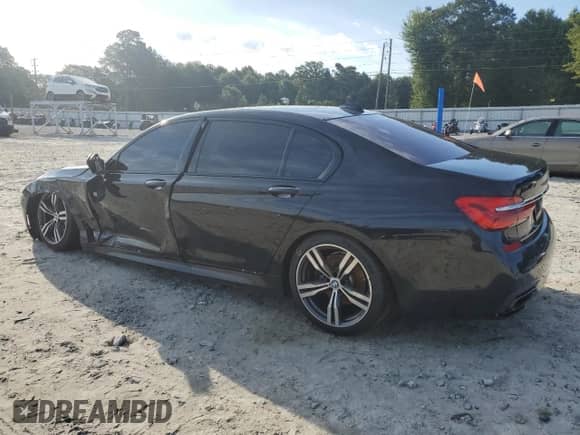 2018 BMW 7 Series 740i с VIN WBA7E2C55JB214956, выставлен на аукционе Copart как лот 63423525 с пробегом 88 274 миль миль и Списание • Salvage title. История ставок и продаж доступна на DreamBid. Изображение 2.
