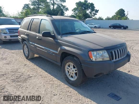 2004 Jeep Grand Cherokee Laredo with VIN 1J4GX48N24C385920, listed as a IAAI auction lot 43027769 with 101,948 mi miles and . Bid and sale history available at DreamBid. Image 1.