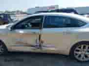 2014 Chevrolet Impala LTZ with VIN 1G1145SL7EU139127, listed as a IAAI auction lot 43249917 with 130,365 mi miles and . Bid and sale history available at DreamBid. Image 14.