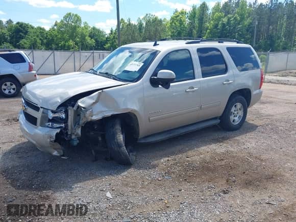 2014 Chevrolet Tahoe LS with VIN 1GNSCAE08ER128141, listed as a IAAI auction lot 42177785 with 108,548 mi miles and . Bid and sale history available at DreamBid. Image 2.