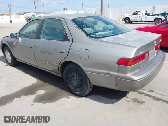 1997 Toyota Camry LE with VIN JT2BG22K9V0023159, listed as a IAAI auction lot 42643720 with 100,412 mi miles and . Bid and sale history available at DreamBid. Image 3.