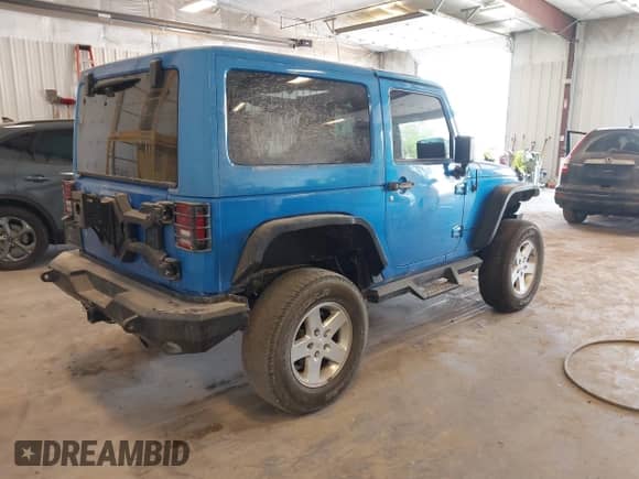 2015 Jeep Wrangler Rubicon Hard Rock z VIN 1C4BJWCG3FL568848, wystawiony jako IAAI lot #42243059 z przebiegiem 60 860 mil mil oraz . Historia ofert i sprzedaży dostępna na DreamBid. Obrazek 4.
