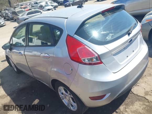 2014 Ford Fiesta S with VIN 3FADP4TJ5EM199405, listed as a IAAI auction lot 41915494 with 127,474 mi miles and . Bid and sale history available at DreamBid. Image 3.