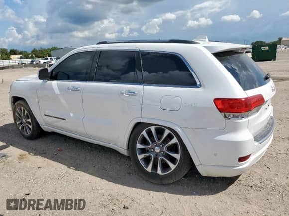 2017 Jeep Grand Cherokee Overland with VIN 1C4RJECG8HC965161, listed as a Copart auction lot 82068045 with 99,654 mi miles and Salvage title. Bid and sale history available at DreamBid. Image 2.