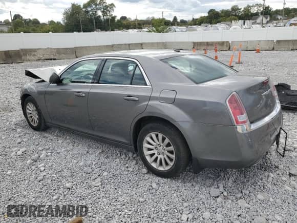 2012 Chrysler 300 with VIN 2C3CCAAG0CH209717, listed as a Copart auction lot 82214315 with 24,250 mi miles and Salvage title. Bid and sale history available at DreamBid. Image 2.