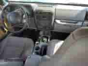 1998 Jeep Wrangler Sport z VIN 1J4FY19S9WP760919, wystawiony jako Copart lot #80940725 z przebiegiem 187 700 mil mil oraz Szkoda całkowita • Salvage title. Historia ofert i sprzedaży dostępna na DreamBid. Obrazek 8.