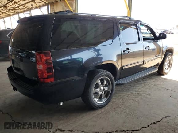 2011 Chevrolet Suburban LS с VIN 1GNSCHE00BR382477, выставлен на аукционе Copart как лот 54735175 с пробегом 117 498 миль миль и Списание • Salvage title. История ставок и продаж доступна на DreamBid. Изображение 3.