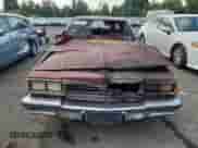 1984 Chevrolet Caprice z VIN 1G1AN69H0EH138172, wystawiony jako Copart lot #72030645 z przebiegiem Nie podano mil oraz Szkoda całkowita • Salvage title. Historia ofert i sprzedaży dostępna na DreamBid. Obrazek 5.
