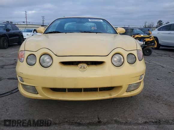 2001 Hyundai Tiburon с VIN KMHJG35F01U231789, выставлен на аукционе Copart как лот 88988265 с пробегом 106 946 миль миль и Чистый • Clean title. История ставок и продаж доступна на DreamBid. Изображение 5.