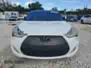 2014 Hyundai Veloster z VIN KMHTC6AD4EU194875, wystawiony jako Copart lot #84427235 z przebiegiem 127 813 mil mil oraz Szkoda całkowita • Salvage title. Historia ofert i sprzedaży dostępna na DreamBid. Obrazek 5.