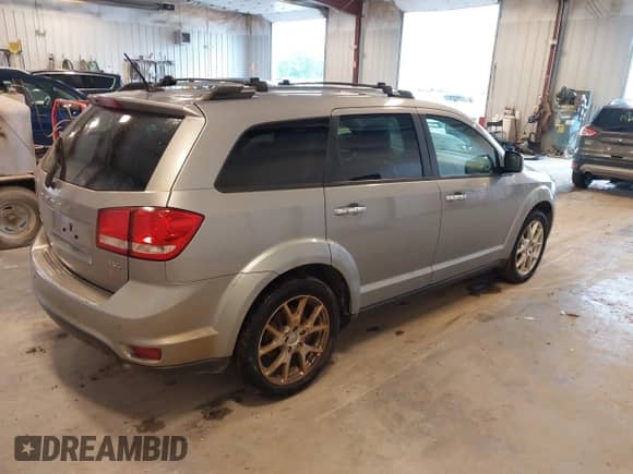 2015 Dodge Journey R/T with VIN 3C4PDDFG2FT715808, listed as a IAAI auction lot 42415079 with 165,828 mi miles and . Bid and sale history available at DreamBid. Image 4.